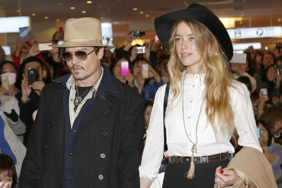 Amber Heard en Johnnny Depp in betere tijden, bij aankomst in Australië in 2015. 