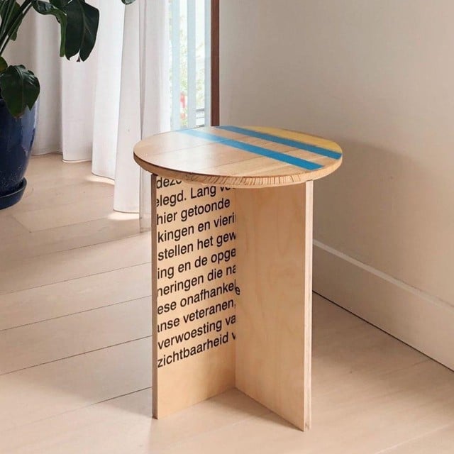 The stool made of panels from an exhibition and the basketball floor. 