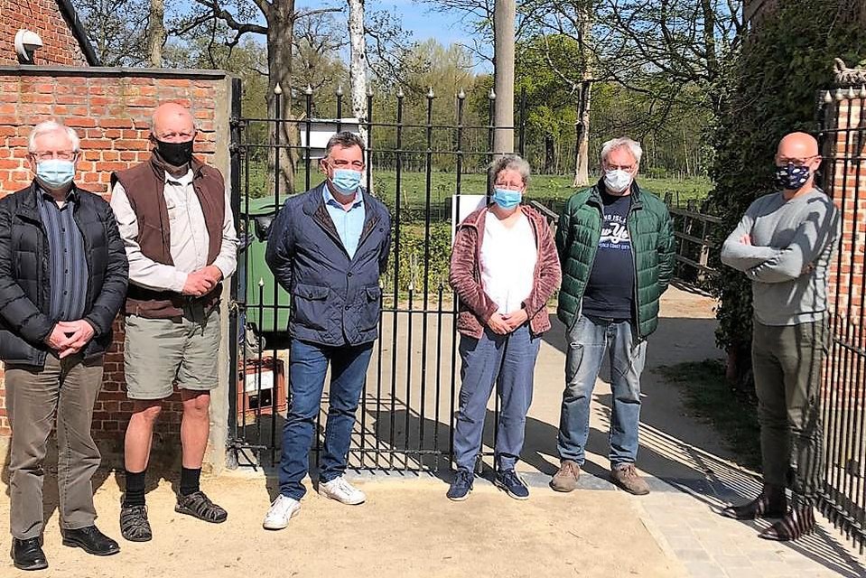 Nancy Hermans and her husband Jan Augustins (third and second from left) in April 2021 during a protest.  The pipes would have entered directly through this gate.
