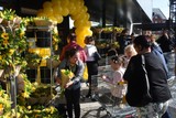 thumbnail: The first three hundred customers received a bouquet of flowers. 