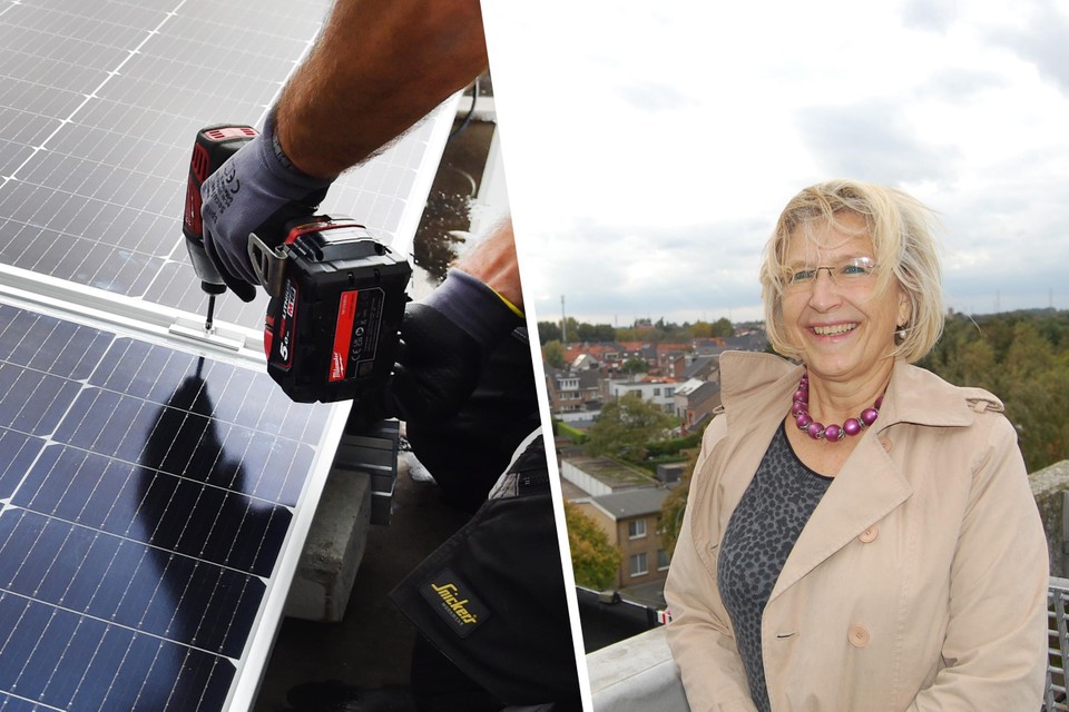Voorzitter van de GMH Ann Cools op het dak van een appartement, binnenkort worden op verschillende daken zonnepanelen geplaatst. 