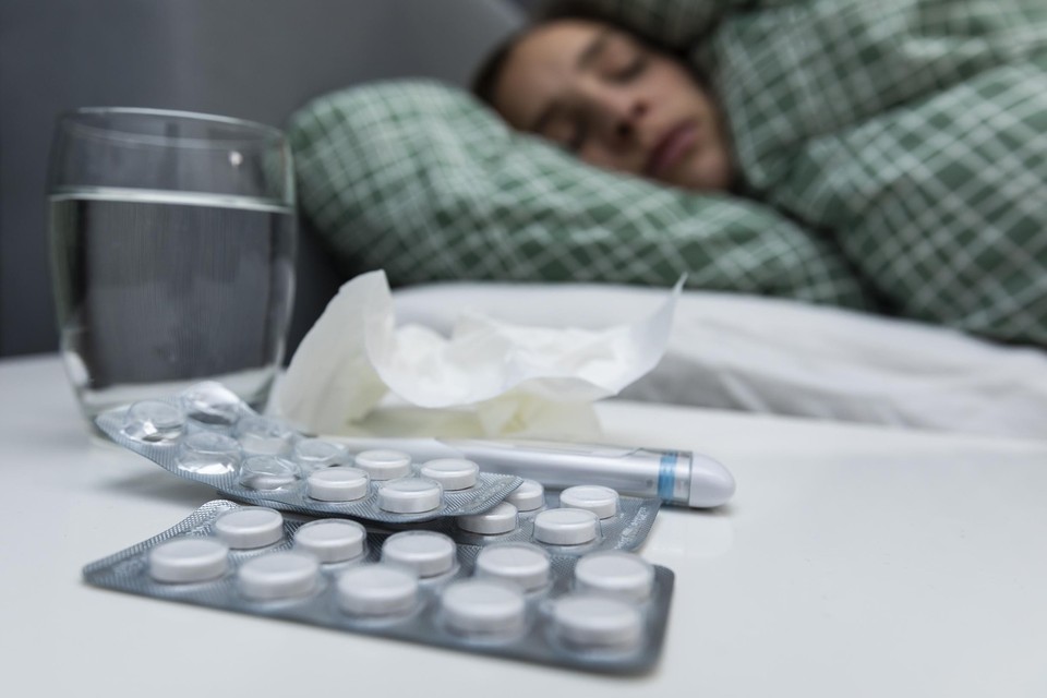 Met koorts en hoofdpijn in bed, best wel wat gevaccineerden hadden gehoopt toch iets ‘goedkoper’ van een besmetting af te raken 