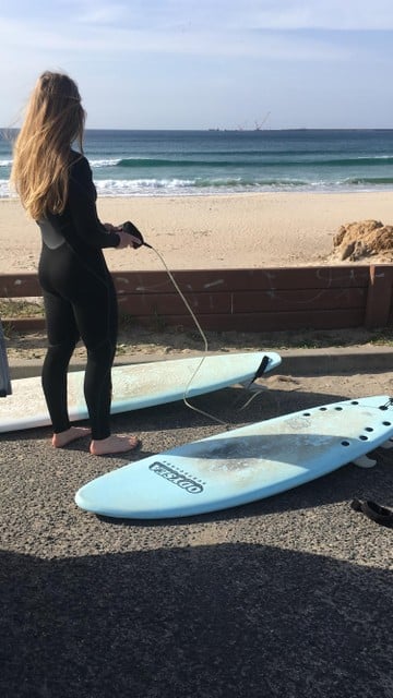 Emilie in surf outfit.  The wetsuits too often end up in the forgotten corner once they are broken. 