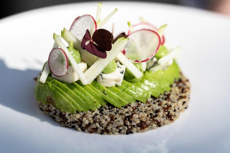 Appetizer of quinoa with other avocado, granny smith and soft gorgonzola. 