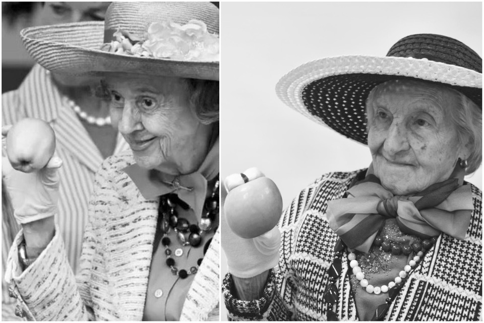 Bewoonster Cecile Crauwels speelt de beroemde foto van wijlen koningin Fabiola uit 2009 na. De koningin verscheen toen na doodsbedreigingen met een appel op het defilé van 21 juli.  